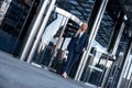 Travel, business trip. Business woman walking out of airport Royalty Free Stock Photo