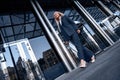 Travel, business trip. Young woman in a suit walking Royalty Free Stock Photo