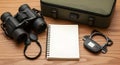 Travel Camera Equipment Set with Binoculars Notebook and Digital Meter on Wooden Surface Royalty Free Stock Photo