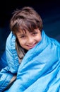 Travel, camping and portrait of child in sleeping bag for resting, relax and comfortable in tent gear. Happy, youth and Royalty Free Stock Photo