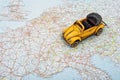 Travel by car. A toy car on Europe map Royalty Free Stock Photo