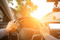 Travel car trip on road at sunset. Happy young man have fun driving inside vehicle in summer sunny day. Driver ride Royalty Free Stock Photo