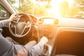 Travel car trip on road at sunset. Happy young man have fun driving inside vehicle in summer sunny day. Driver ride vacation Royalty Free Stock Photo