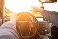 Travel car trip on road at sunset. Happy young man have fun driving inside vehicle in summer sunny day. Driver ride vacation Royalty Free Stock Photo