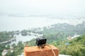 Travel concept: action camera in the sea, leaning on a rock.