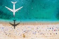 Travel concept with an airplane flying over a crowded beach