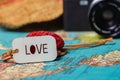 Travel concept background .A love sing on a map with a retro cam