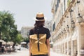 Travel concept, beautiful traveler woman walking in Corfu old town during vacation, cheerful student girl traveling abroad Royalty Free Stock Photo