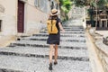 Travel concept, beautiful tourist woman walking in old town during vacation, cheerful student girl traveling abroad in summer. Royalty Free Stock Photo