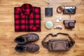 Travel concept boots, shirt, camera, lighter, flask, bag, penknife Royalty Free Stock Photo