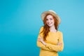 Travel concept - Close up Portrait young beautiful attractive redhair girl wtih trendy hat and sunglass smiling. Blue Royalty Free Stock Photo