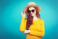 Travel concept - Close up Portrait young beautiful attractive redhair girl wtih trendy hat and sunglass smiling. Blue Royalty Free Stock Photo