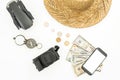 Travel concept. Drone, straw hat, photo camera, compass and usa cash on white background. Flat lay, top view. Royalty Free Stock Photo