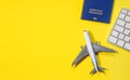Travel concept with flat lay of international biometric passport, little airplane,