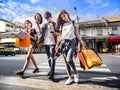 Travel concept.group of happy friend are traveling.tourist holding shopping bag Cross the crosswalk Royalty Free Stock Photo