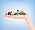 Travel concept. Hand holding atribute of travel and holiday. Royalty Free Stock Photo