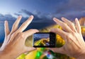 Travel concept. Hand making photo of city with smartphone camera. BATUMI, ADJARA, GEORGIA Royalty Free Stock Photo