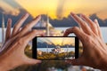 Travel concept. Hands making photo of night city with smartphone camera. Istanbul at sunset. Turkey Royalty Free Stock Photo