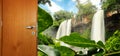 Travel concept image. Opening the door to a new special place. Waterfalls at background