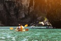 Travel concept with kayakers on sea bay backdrop Royalty Free Stock Photo