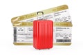 Travel Concept. Large Red Polycarbonate Suitcase in front of Two Golden Business or First Class Airline Boarding Pass Fly Air Royalty Free Stock Photo