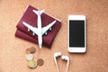 Travel concept with passports, plane, phone and headphone. Top view. Flat lay.