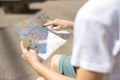 Travel concept photo with map of old european town and woman`s finger Royalty Free Stock Photo