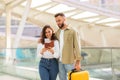 Travel Concept. Portrait Of Happy Young Couple Waiting For Flight At Airport Royalty Free Stock Photo