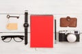 travel concept - set of cool stuff with camera and other things on wooden table