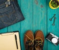 Travel concept - shoes, jeans, notepad, clipboard, camera, watch