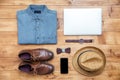 Travel concept shoes, shirt, mobile phone, watch, laptop, hat