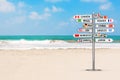 Travel Concept. Signpost with Various Countries Names and Flags on the Ocean Beach. 3d Rendering