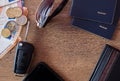 Travel concept. Smartphone, money, car key, passports, sunglasses and wallet on wooden background