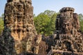 Travel concept. Stone murals and statue Bayon Temple Angkor Thom. Angkor Wat the largest religious monument in the world. Ancient Royalty Free Stock Photo