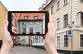 tourist photographs house in Riga ciity