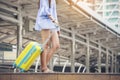 Travel concept.At train station,Young Tourist Girl walking,Dragging luggage suitcase bag and searching hotel.Asian women waiting Royalty Free Stock Photo