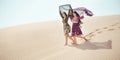 Travel concept. Two gordeous women sisters traveling in desert. Royalty Free Stock Photo