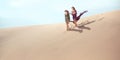 Travel concept. Two gordeous women sisters traveling in desert.