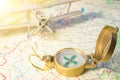 Travel concept. vintage compass on a map and plane in the background. Royalty Free Stock Photo