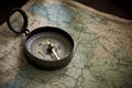 Travel concept of vintage compass on old and aged map. Generative AI Royalty Free Stock Photo