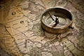 Travel concept of vintage compass on old and aged map. Generative AI Royalty Free Stock Photo