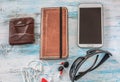 Travel concept with wallet ,book,cell phone,glasses and headset Royalty Free Stock Photo