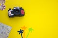 Travel concept yellow background with photo camera Royalty Free Stock Photo