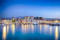 Travel Concepts. Picturesque Image of Old Venetian Harbour of Chania with Fisihing Boats and Yachts on the Foregound Taken At Blue Royalty Free Stock Photo