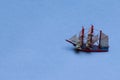 Travel Concepts. Scale Model of Three-Masted Sail Boat Placed Over Blue Background Royalty Free Stock Photo