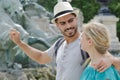 travel couple trowing coin at trevi fountain Royalty Free Stock Photo