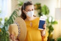 Happy stylish solo traveller woman in living room in sunny day Royalty Free Stock Photo