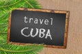 Travel Cuba palm trees and blackboard on sandy beach Royalty Free Stock Photo