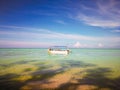 Travel destination, Malaysia. Flag of Sabah on sailing boat Mantanani Island