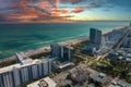 Travel destination and tourism infrastructure in southern USA. South Beach sandy surface with tourists relaxing on hot Royalty Free Stock Photo